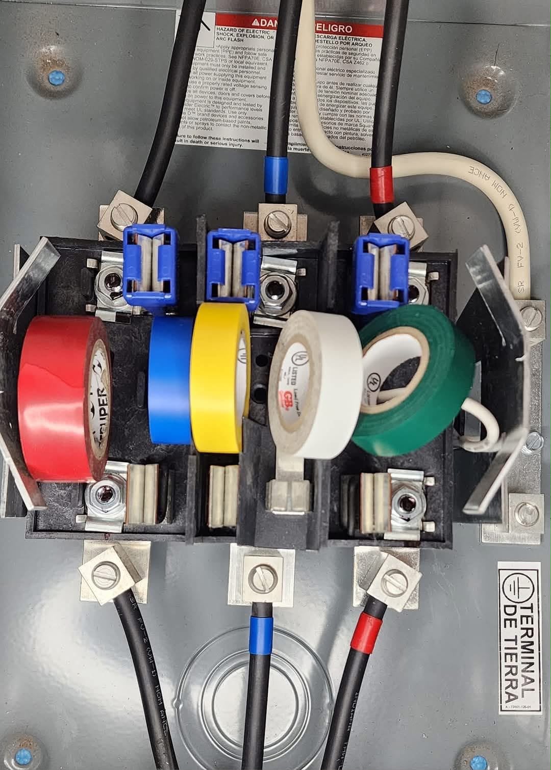 Meter base with color-coded phase wiring and taping